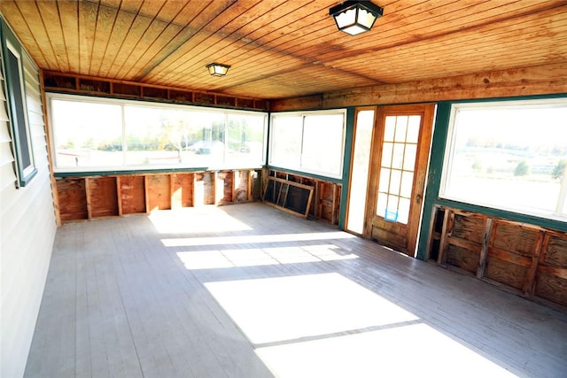 unfurnished sunroom featuring wood ceiling