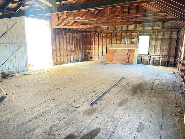 miscellaneous room with lofted ceiling