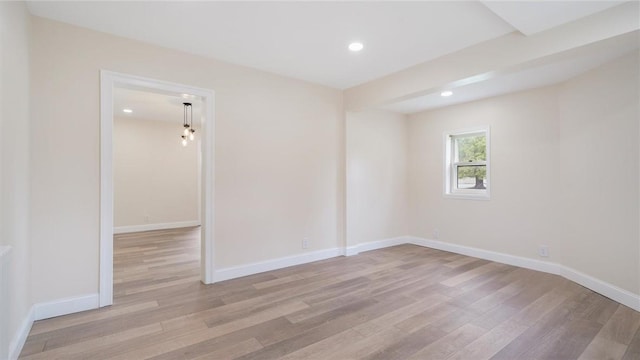 unfurnished room with light hardwood / wood-style flooring