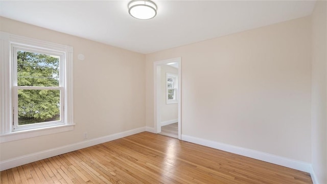 unfurnished room with light hardwood / wood-style flooring