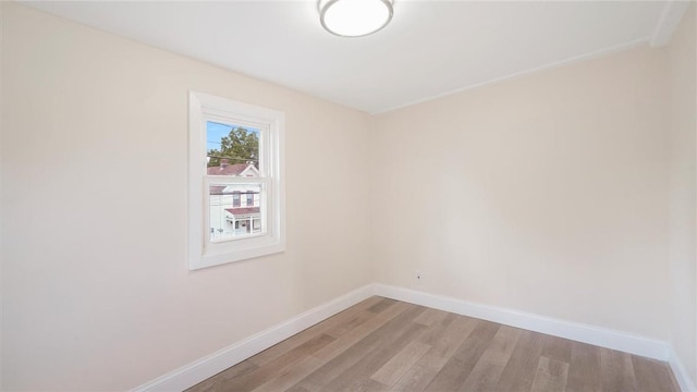 unfurnished room with light hardwood / wood-style floors