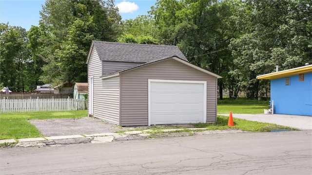 garage featuring a yard