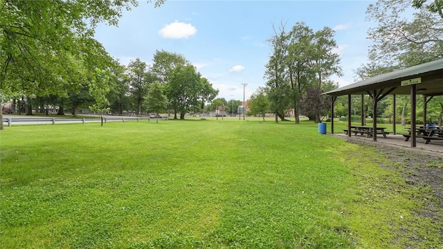 view of property's community with a lawn