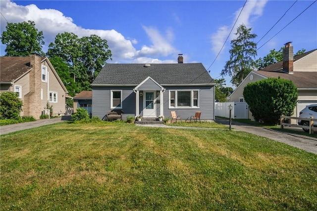 bungalow-style home with a front lawn