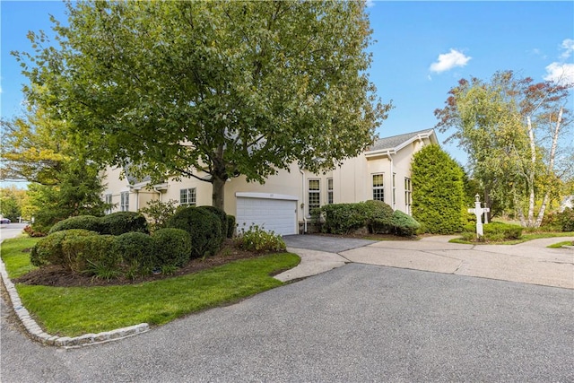 obstructed view of property featuring a garage