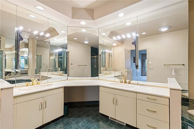 bathroom featuring tile patterned flooring, vanity, and walk in shower