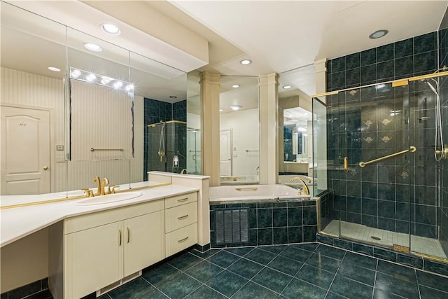 bathroom featuring vanity, separate shower and tub, and tile patterned floors