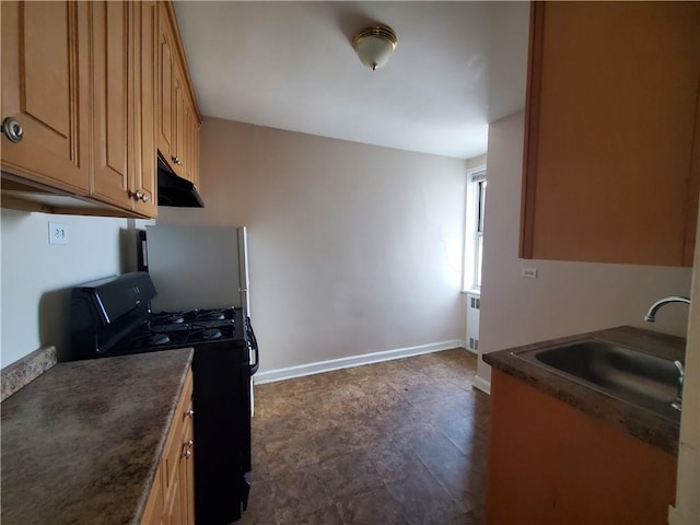 kitchen featuring dark hardwood / wood-style flooring, black range with gas cooktop, sink, white refrigerator, and radiator heating unit