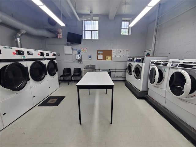 clothes washing area featuring washer and dryer