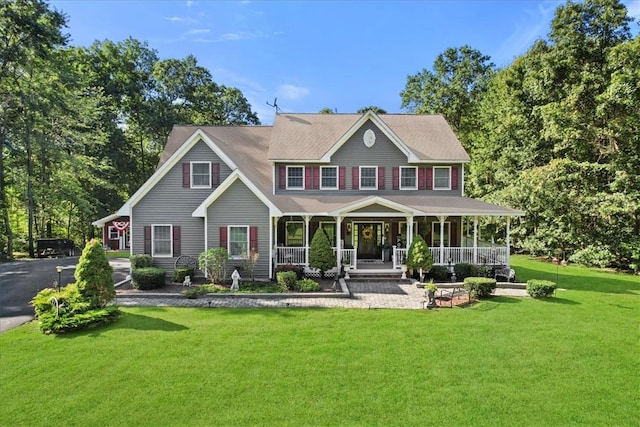 view of front of home featuring covered porch and a front yard