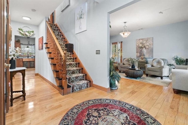 entryway with hardwood / wood-style flooring