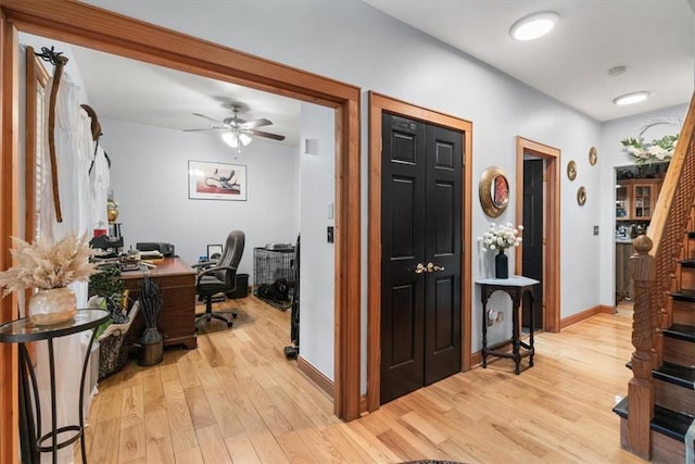 office area featuring ceiling fan and light wood-type flooring