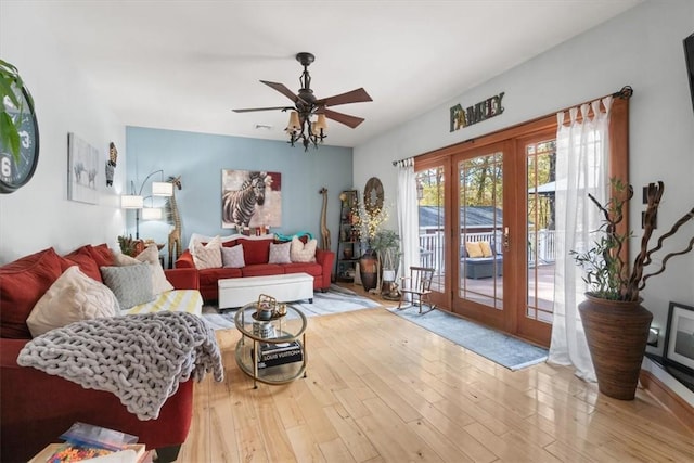 living room with ceiling fan, light wood-type flooring, and french doors