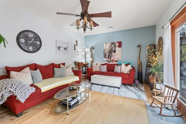 living room featuring hardwood / wood-style flooring and ceiling fan