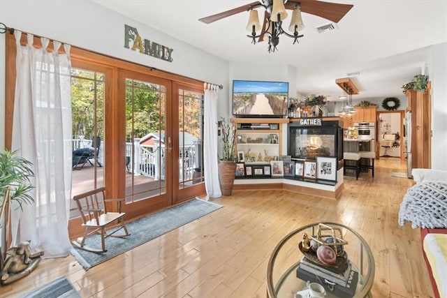 doorway to outside with french doors and light hardwood / wood-style flooring