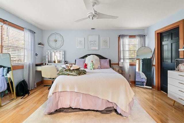 bedroom with ceiling fan and light wood-type flooring