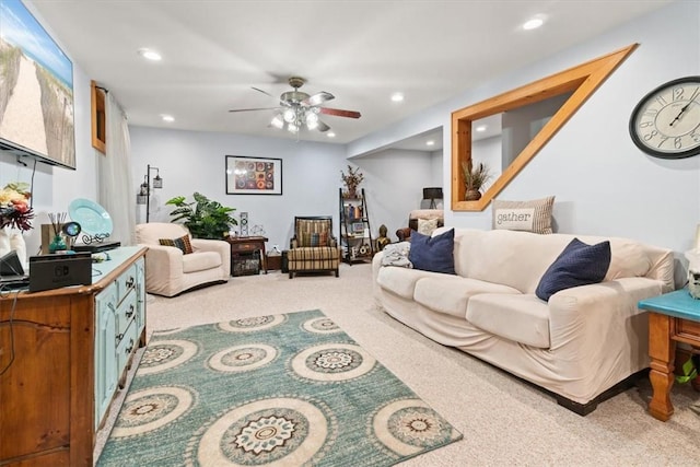 carpeted living room featuring ceiling fan