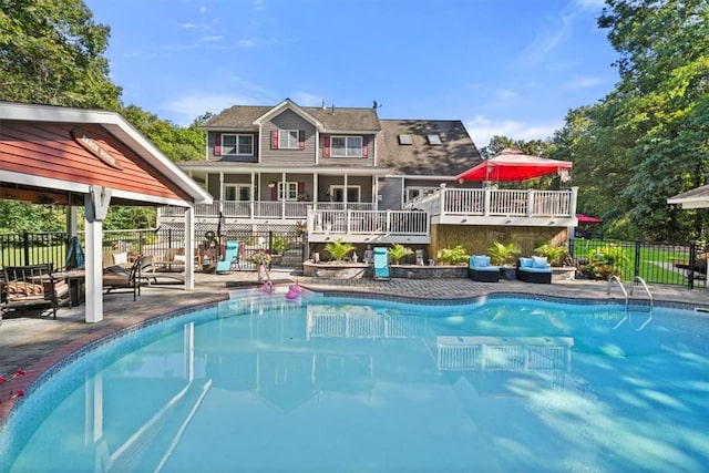 view of pool with a patio area and a deck