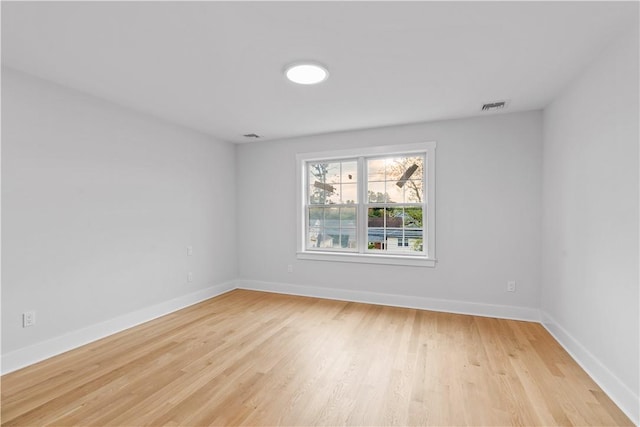 unfurnished room featuring light hardwood / wood-style floors