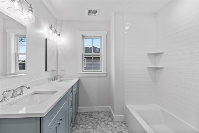 bathroom with tile patterned flooring and vanity