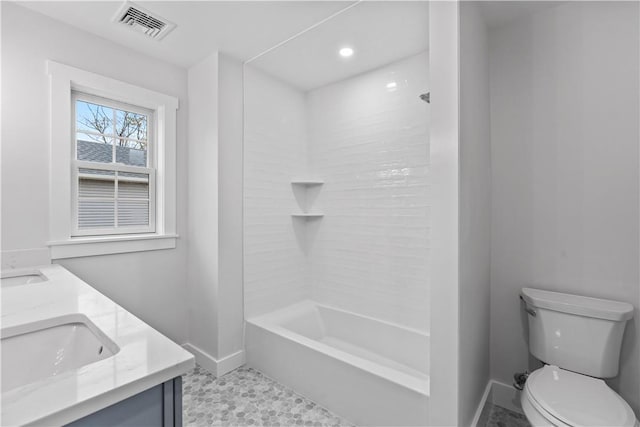 full bathroom featuring vanity, toilet, and tiled shower / bath