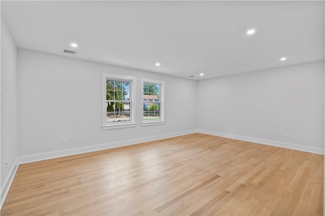 unfurnished room with light hardwood / wood-style flooring