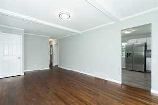 empty room featuring dark wood-type flooring