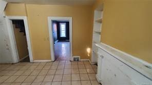 interior space with light tile patterned floors