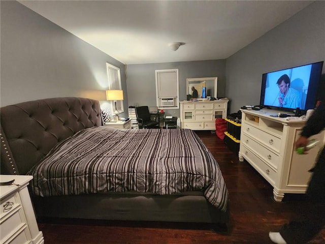 bedroom with dark hardwood / wood-style floors and cooling unit