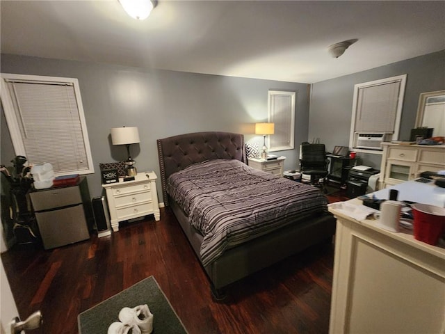 bedroom with dark hardwood / wood-style flooring, white fridge, and cooling unit