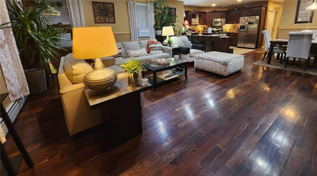 living room with dark hardwood / wood-style floors