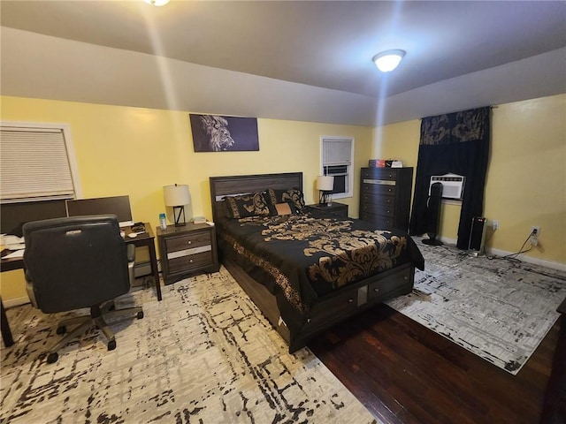 bedroom with wood-type flooring