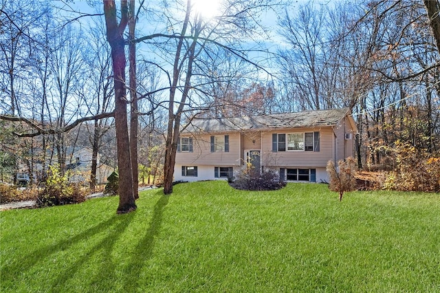 bi-level home with a front lawn