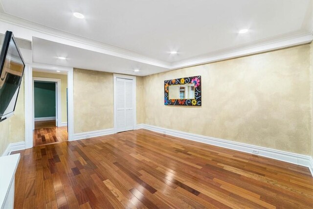 interior space featuring hardwood / wood-style floors and ornamental molding