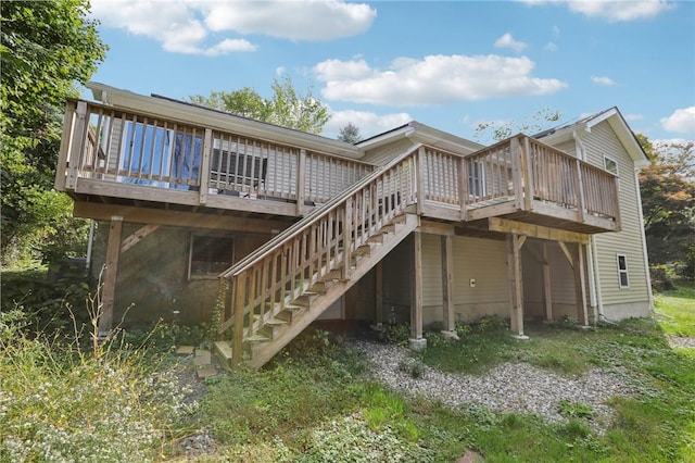 back of property with a wooden deck