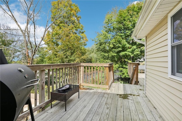 wooden deck with area for grilling