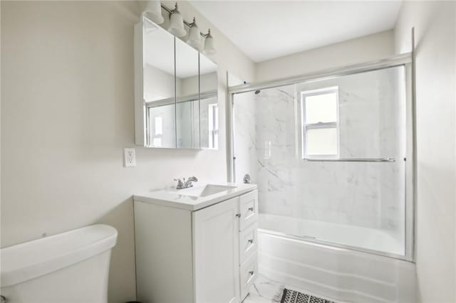 full bathroom featuring vanity, toilet, and enclosed tub / shower combo