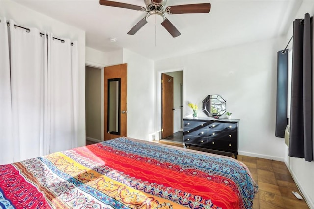 bedroom with hardwood / wood-style floors and ceiling fan