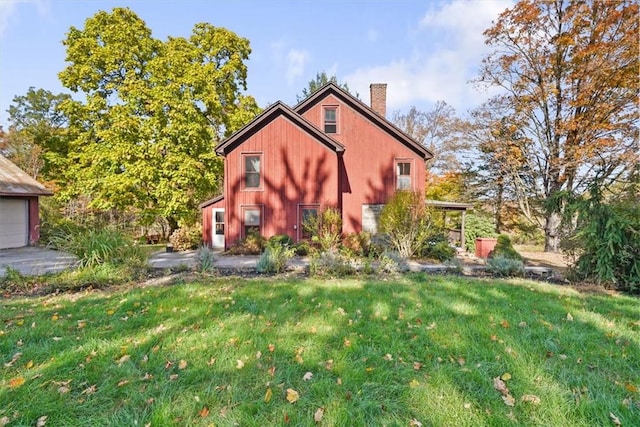 view of side of property with a yard