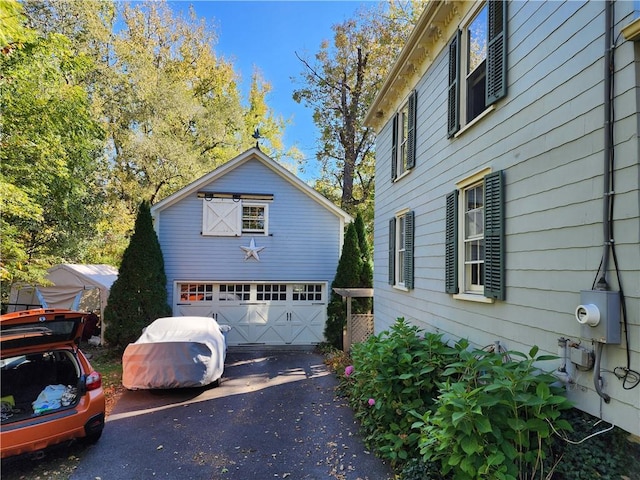 view of property exterior with a garage