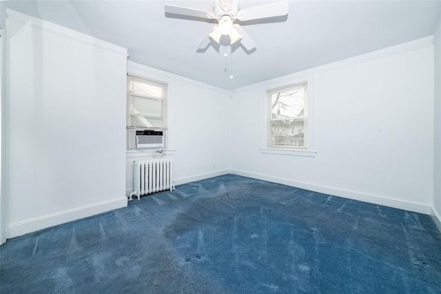 carpeted empty room featuring radiator heating unit, cooling unit, a healthy amount of sunlight, and ceiling fan