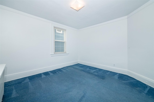 spare room with carpet floors and ornamental molding