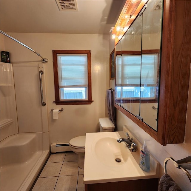 bathroom with tile patterned flooring, a shower, baseboard heating, and a wealth of natural light