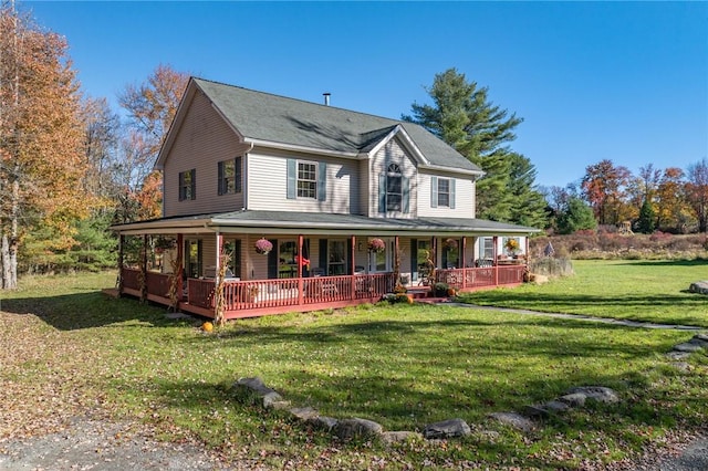 farmhouse with a front yard and a porch