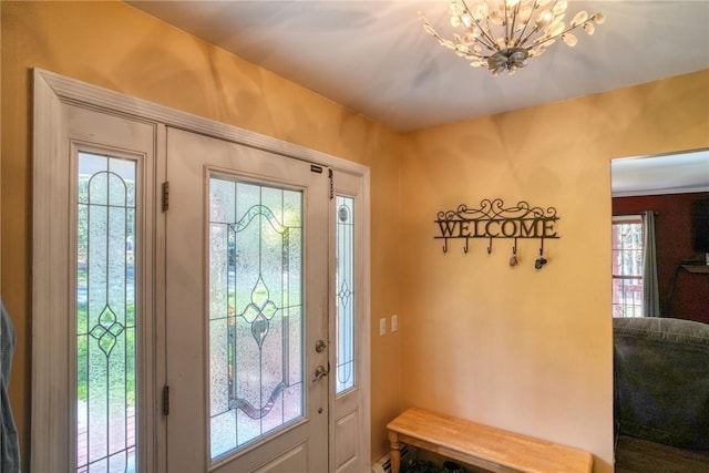 entrance foyer featuring a notable chandelier