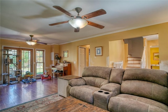 living room featuring ceiling fan, ornamental molding, and dark wood-type flooring