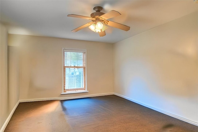 empty room featuring ceiling fan and carpet floors