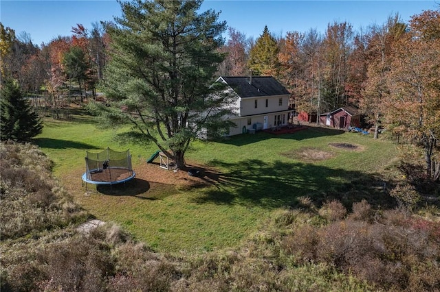 view of yard featuring a trampoline