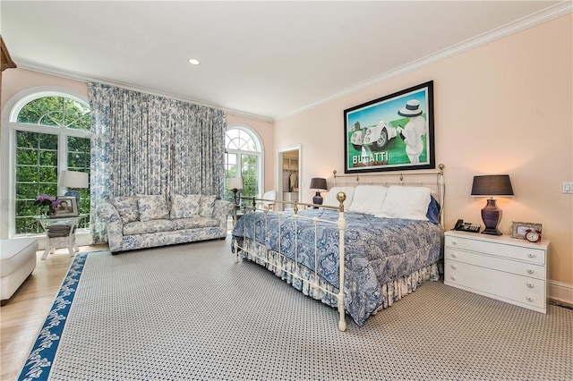 bedroom featuring hardwood / wood-style floors and crown molding