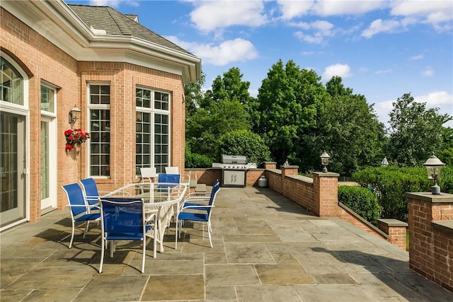 view of patio featuring exterior kitchen and grilling area